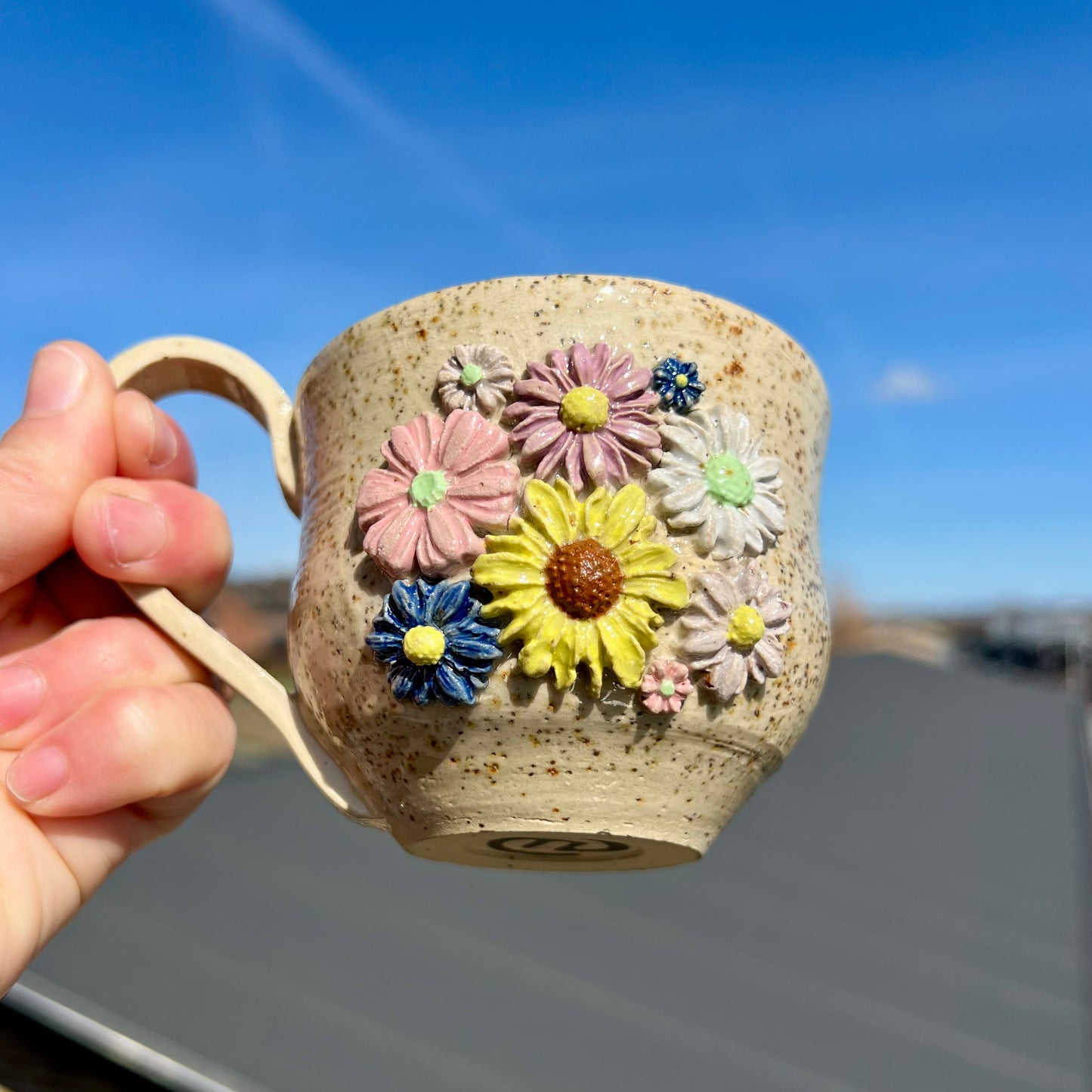 Keramikkop med blomster